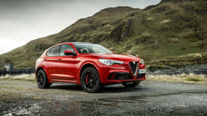 Sleek Alfa Romeo Stelvio In The Wild Wallpaper