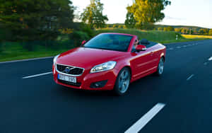 Sleek And Beautiful Volvo C70 Car On The Move Wallpaper