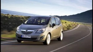 Sleek And Classy Opel Meriva In Modern Cityscape Wallpaper