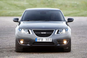 Sleek And Classy Saab 9-5 On Mountain Road Wallpaper