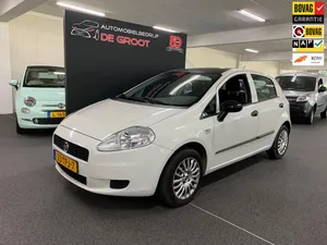 Sleek And Compact Fiat Punto In Urban Setting Wallpaper