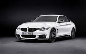 Sleek And Dynamic Bmw 4 Series In Action Wallpaper