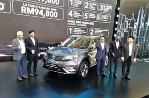 Sleek And Dynamic Proton X70 On The Open Road Wallpaper