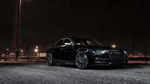 Sleek And Elegant Audi A4 On The Road Wallpaper