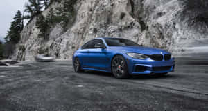 Sleek And Elegant Bmw 4 Series In Motion Wallpaper