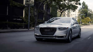 Sleek And Elegant Genesis G90 On The Road Wallpaper