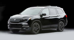 Sleek And Functional Honda Pilot Suv On A Picturesque Highway Wallpaper