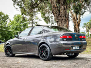 Sleek And Iconic Alfa Romeo 156 In Its Full Glory Wallpaper