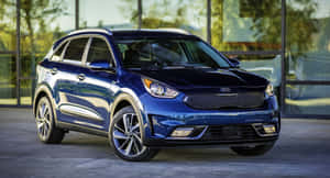 Sleek And Innovative Kia Niro On A Scenic Drive Wallpaper