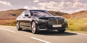 Sleek And Luxurious Bmw 7 Series In Motion Wallpaper