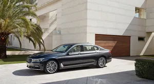Sleek And Luxurious Bmw 7 Series Sedan In Action Wallpaper
