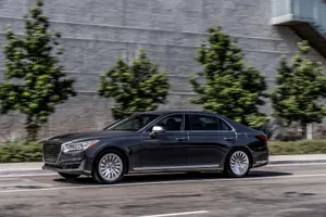 Sleek And Luxurious Genesis G90 In Motion Wallpaper