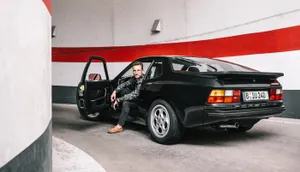 Sleek And Luxurious Porsche 944 Under Night Lights Wallpaper