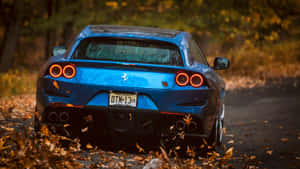 Sleek And Luxurious Red Ferrari Gtc4lusso In Action Wallpaper