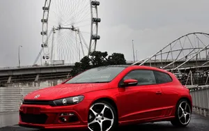 Sleek And Luxurious Volkswagen Scirocco In Motion Wallpaper
