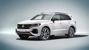 Sleek And Luxurious Volkswagen Touareg In Urban Setting Wallpaper