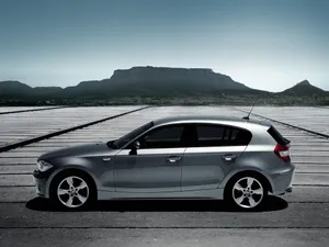 Sleek And Modern Bmw 1 Series On Road Wallpaper