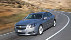 Sleek And Modern Chevy Malibu Cruising Wallpaper