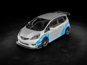 Sleek And Modern Honda Fit In Motion Wallpaper