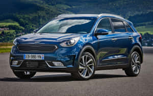 Sleek And Modern Kia Niro On The Road Wallpaper