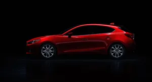 Sleek And Modern Mazda 3 Hatchback On The Road Wallpaper