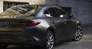 Sleek And Modern Mazda 3 Hatchback On Urban Road Wallpaper