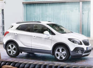 Sleek And Modern Opel Mokka On The Road Wallpaper