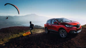 Sleek And Modern Renault Kadjar Cruising On An Open Road Wallpaper