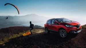 Sleek And Modern Renault Kadjar Cruising On An Open Road Wallpaper