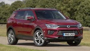 Sleek And Modern Ssangyong Vehicle On A Scenic Road Wallpaper