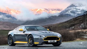 Sleek And Powerful Aston Martin V12 Vantage On The Road Wallpaper