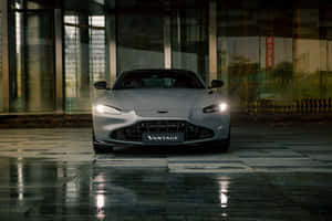 Sleek And Powerful Aston Martin Vantage On The Road Wallpaper