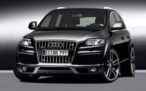 Sleek And Powerful Audi Q7 In A Stunning Urban Setting Wallpaper