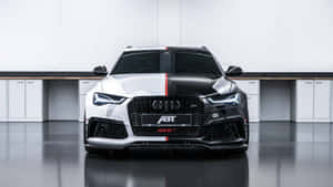 Sleek And Powerful Audi Rs6 In Action Wallpaper