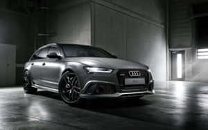 Sleek And Powerful Audi Rs6 In Motion Wallpaper