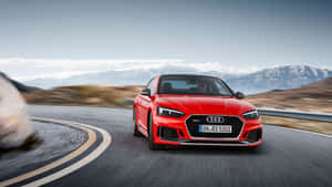 Sleek And Powerful Audi S5 On The Road Wallpaper