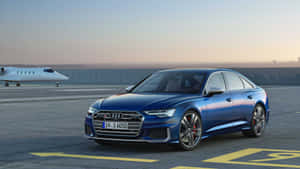 Sleek And Powerful Audi S6 In Action Wallpaper