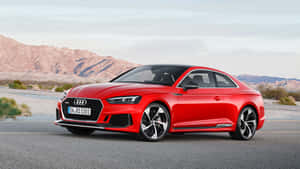 Sleek And Powerful Audi S6 In Vibrant Night Setting Wallpaper