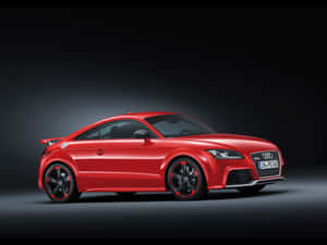 Sleek And Powerful Audi Tt Rs On The Road Wallpaper