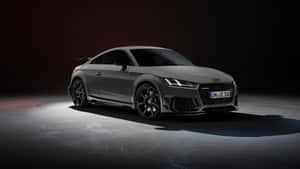 Sleek And Powerful Audi Tt Rs On The Road Wallpaper