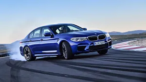 Sleek And Powerful Bmw M5 In Action Wallpaper