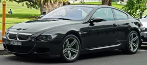 Sleek And Powerful Bmw M6 On The Road Wallpaper