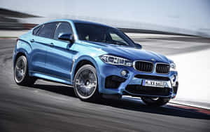 Sleek And Powerful Bmw X6 In Motion Wallpaper