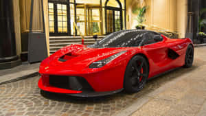 Sleek And Powerful Ferrari Laferrari At Top Speed Wallpaper