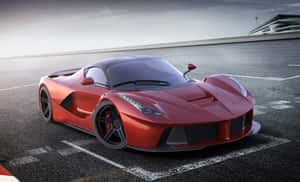 Sleek And Powerful Ferrari Laferrari On The Road Wallpaper