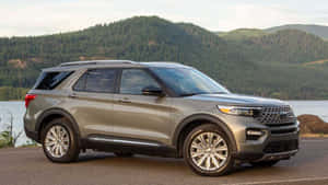 Sleek And Powerful Ford Explorer On Scenic Background Wallpaper