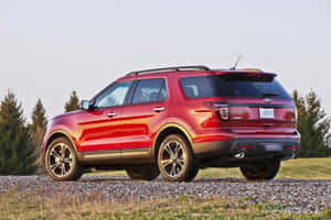 Sleek And Powerful Ford Explorer On The Road Wallpaper