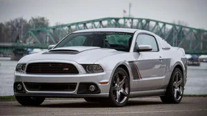 Sleek And Powerful Ford Mustang Roush On The Move Wallpaper
