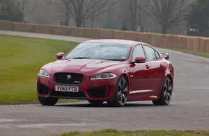 Sleek And Powerful Jaguar Xfr In Action Wallpaper