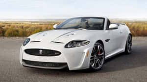 Sleek And Powerful Jaguar Xkr On The Road Wallpaper